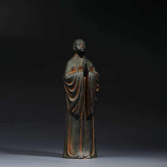 Standing monk Buddha statue symbolizing discipline and inner strength Zen decor sculpture