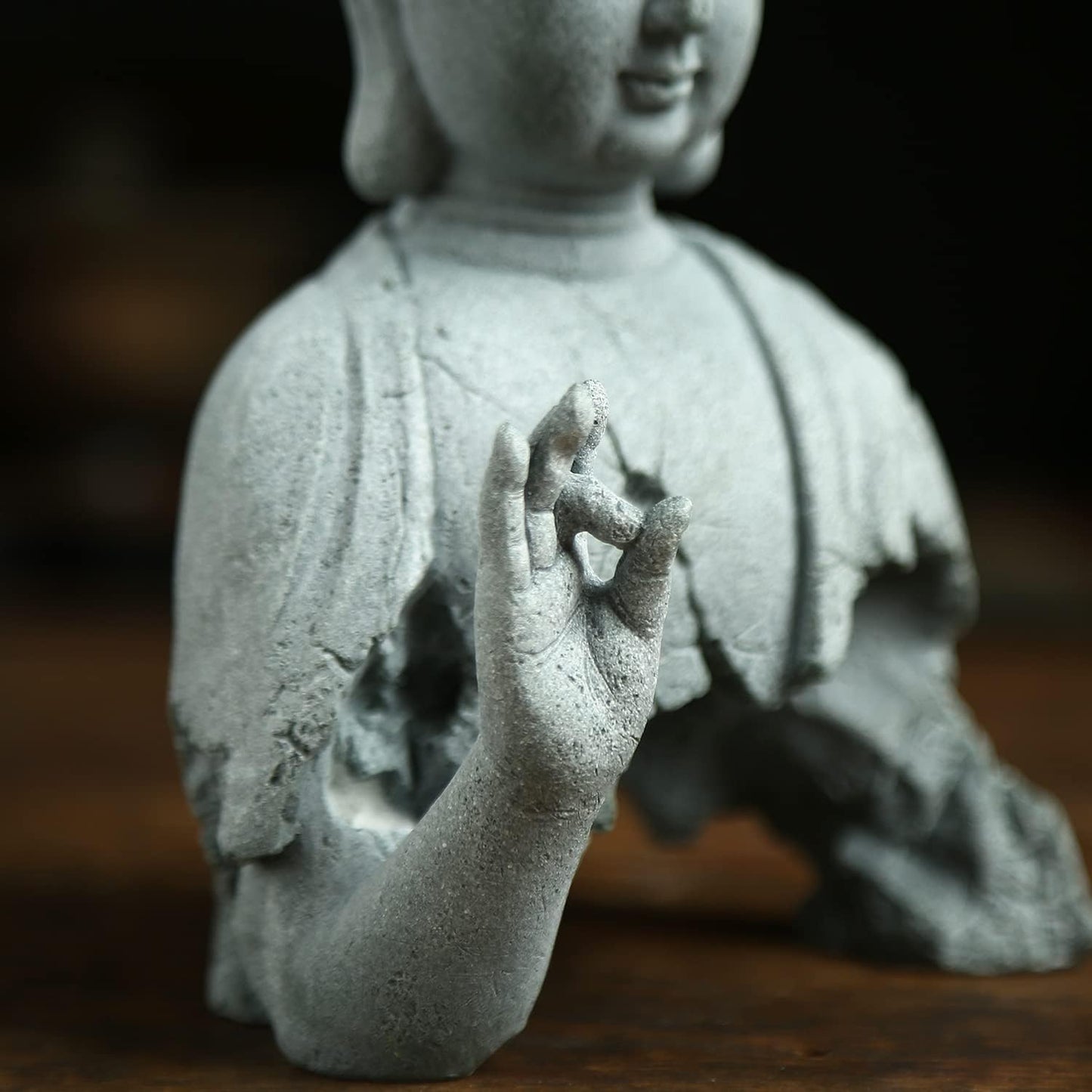Close up detail of Zen Buddha meditation sculpture handcrafted decor