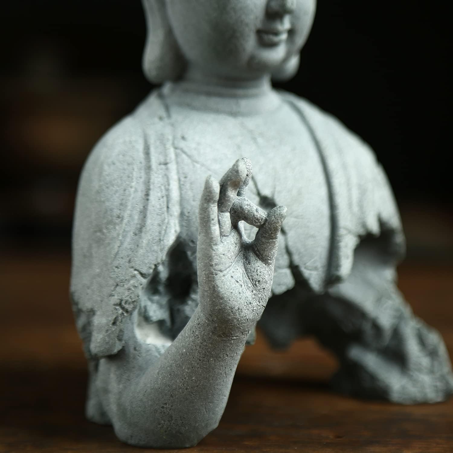 Close up detail of Zen Buddha meditation sculpture handcrafted decor
