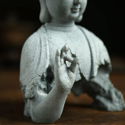 Close up detail of Zen Buddha meditation sculpture handcrafted decor