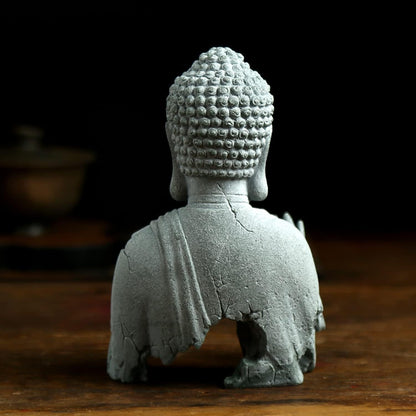 Close up detail of Zen Buddha meditation sculpture handcrafted decor