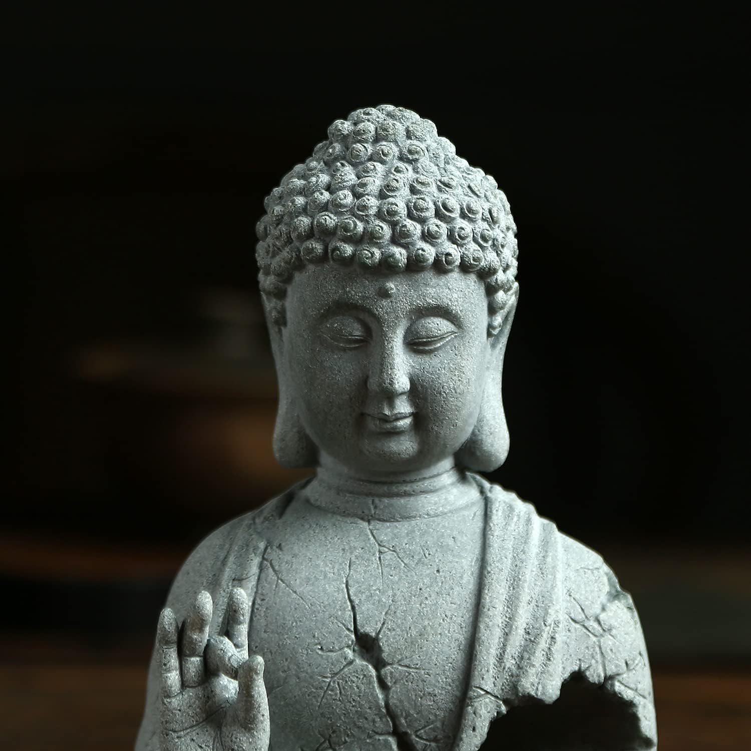 Close up detail of Zen Buddha meditation sculpture handcrafted decor