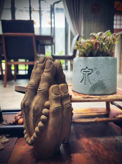 Buddha Namaste statue placed in peaceful meditation or yoga room