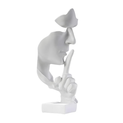 Front view of modern Zen thinker statue silence is gold meditation sculpture