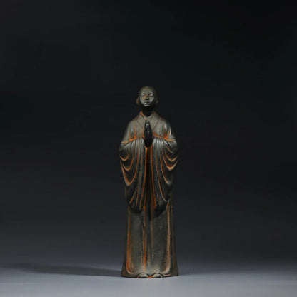 Standing monk Buddha statue symbolizing discipline and inner strength Zen decor sculpture