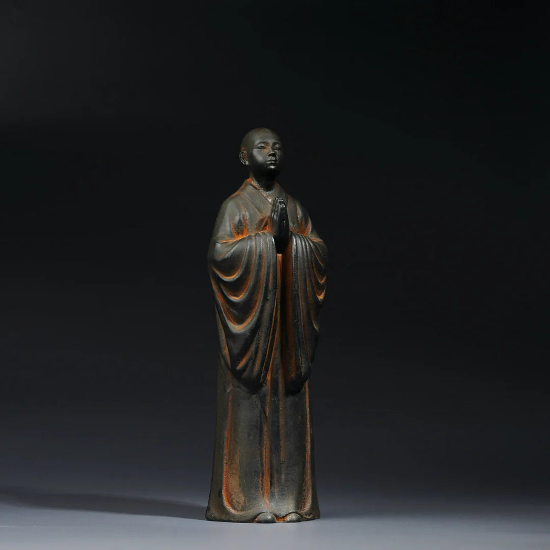 Standing monk Buddha statue symbolizing discipline and inner strength Zen decor sculpture