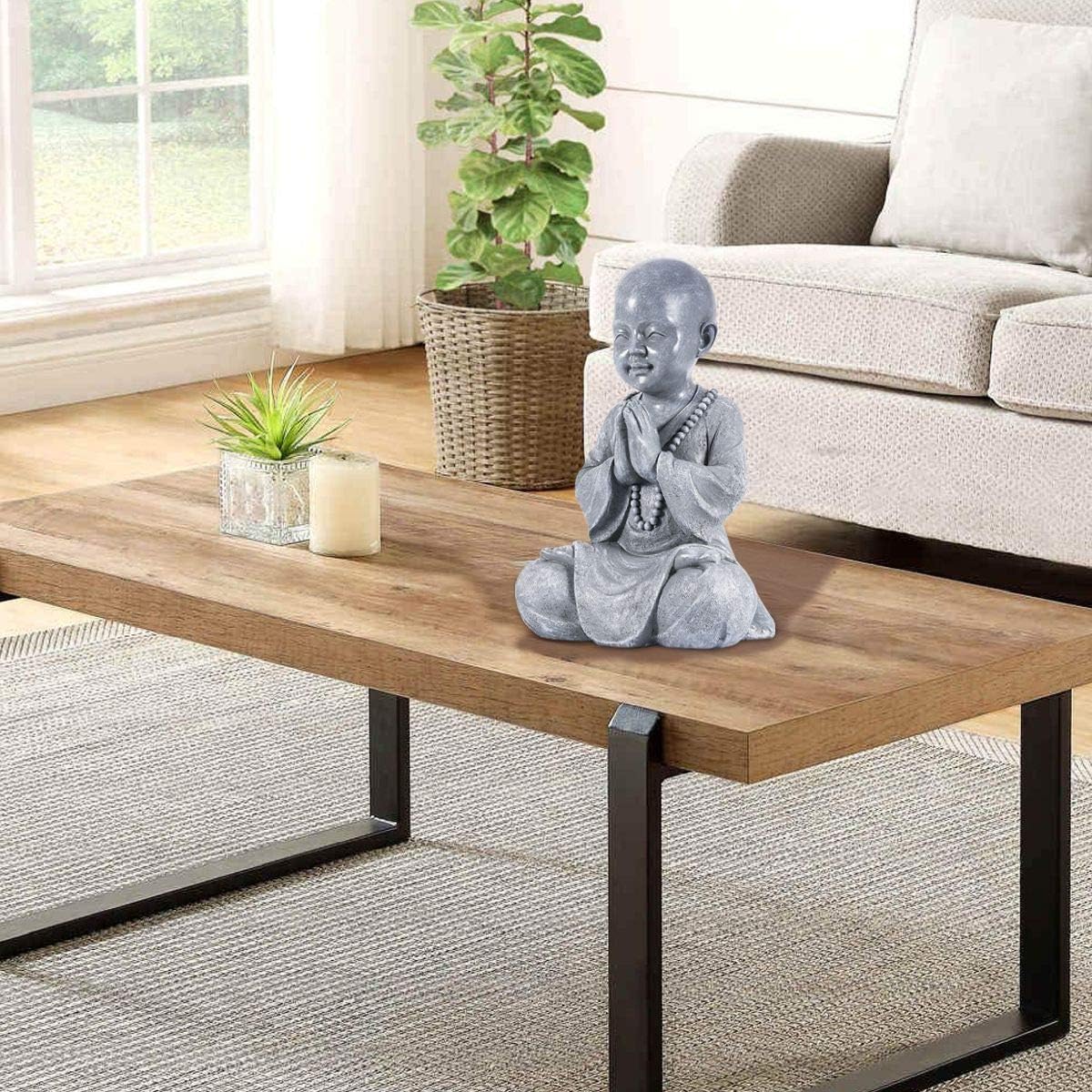 Close up detail of baby Buddha meditation statue handcrafted Zen decor