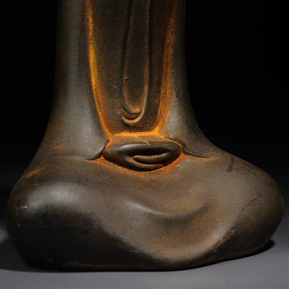Zen Buddha statue with natural sandstone texture – modern Buddhist sculpture for calm home atmosphere