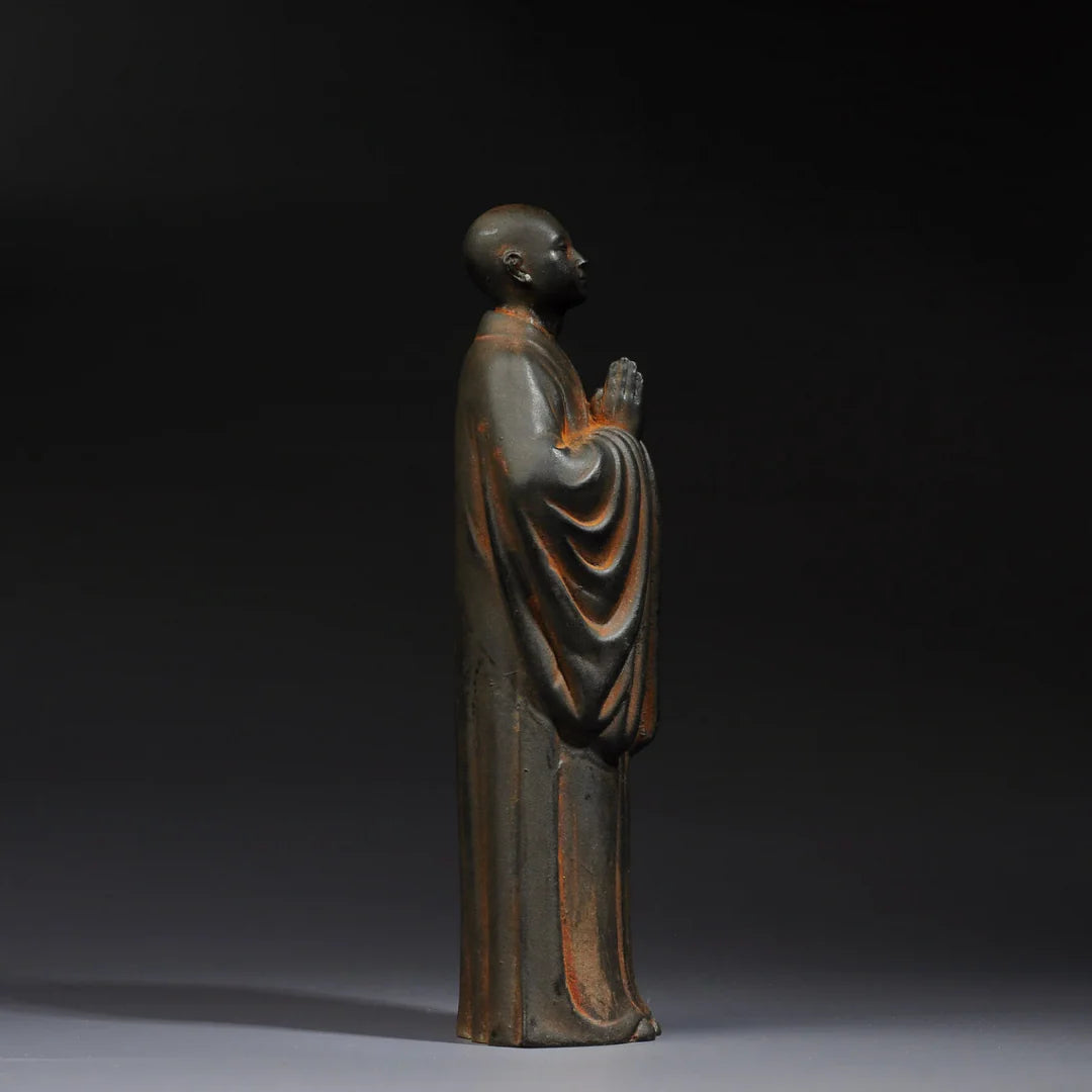Close-up detail of Zen monk statue handcrafted Buddhist art sculpture